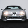 Front close-up of Alfa Romeo GTV V6 with lights on – Redline Competitions