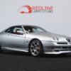 Red Alfa Romeo GTV V6 with 18” Blackline alloy wheels shown at a front side angle – Redline Competitions