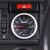 Close-up of Turbosmart turbo boost gauge mounted in Nova interior
