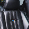 Close-up of full black leather seat with M Sport branding