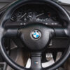 Close-up of BMW E30 M Sport steering wheel with m sport detailing