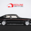 1984 Ford Capri 2.8i side profile, black with red coachline, available to win in a UK redline competition.