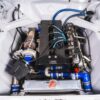 Engine bay of 1964 Ford Cortina Cosworth showing Cosworth YB turbo engine