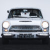 Front view of Ford Cortina Cosworth with headlights on