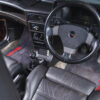 Side angle interior shot of 1990 Vauxhall Astra GTE Champion Edition showing dash and seats – Redline Competitions