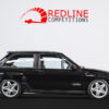 Side profile of the 1992 Vauxhall Nova Z20LET Turbo in black with GSi styling.