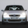 Silver VW Lupo GTi with headlights on, front view, Redline Competitions UK car competition.