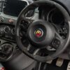 Driver’s point of view of the Fiat 595 Abarth Competizione showing dash and steering wheel. Redline Competitions 9p competition with instant wins.