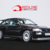 Ford Escort RS Cosworth aubergine angled front side view showing Big Turbo conversion, 18’’ Compomotive alloy wheels, black Recaro leather interior | Redline Competitions