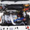 Wide shot of Ford Escort RS Turbo Series 2 engine bay, win with Redline Competitions