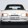 White Ford Escort RS Turbo Series 2 with headlights on, win with Redline Competitions