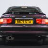 Rear angle of Ford Escort RS 2000 in Aubergine with RS badging at Redline Competitions.