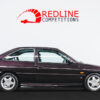 Full side profile of Ford Escort RS 2000 in Aubergine with RS alloys at Redline Competitions.