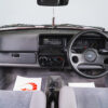 Wide interior shot of the MK2 Ford Fiesta Zetec swap, showing dash, steering wheel and gear stick.