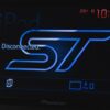 Close-up of ST-themed Pioneer infotainment retrofit in black Ford Focus ST3 | Redline Competitions