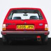 Rear end of the MK2 Ford Fiesta Zetec swap in red, with classic Ghia badging and exhaust visible.
