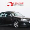 Black Peugeot 106 GTi front side view showing clean respray, sharp lines, and restored hot hatch details – Redline Competitions