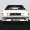 Front angle of the 1988 VW Scirocco Scala with headlights switched on.
