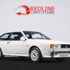 Front side angle of the 1988 VW Scirocco Scala in Alpine White, available to win with Redline Competitions.