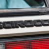 Volkswagen branding badge close-up on rear of 1988 Scirocco Scala.