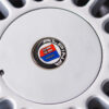 BMW E30 M-tech II red close-up of Alpine badge on alloy wheel – Redline Competitions