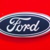 Rear Ford badge close-up on Radiant Red Ford Sierra Sapphire UK competition car.