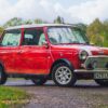 Front angle of a restored 1996 Mini Cooper 1.3 SPi in red with Union Jack roof at Redline Competitions