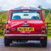 Rear view of the restored 1996 Mini Cooper 1.3 SPi in red showing chrome details at Redline Competitions