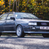 Grey Audi Quattro front three quarter view showing box arches and B2 chassis styling available to win with Redline Competitions