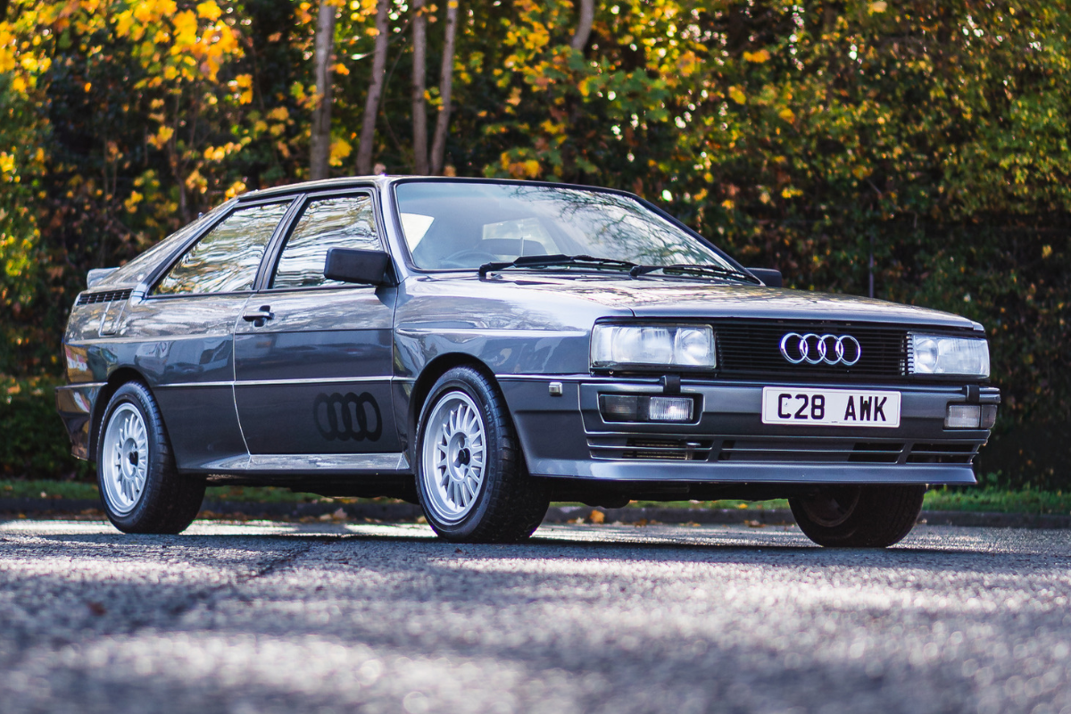 Grey Audi Quattro front three quarter view showing box arches and B2 chassis styling available to win with Redline Competitions