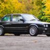 BMW E30 325i Sport front POV with MTech II kit in black available to win with Redline Competitions
