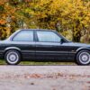 E30 BMW 325i Sport MTech II side profile in black, available to win with Redline Competitions