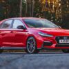Hyundai i30N 2.0 T-GDi N Performance in Engine Red front three quarter view – Redline Competitions
